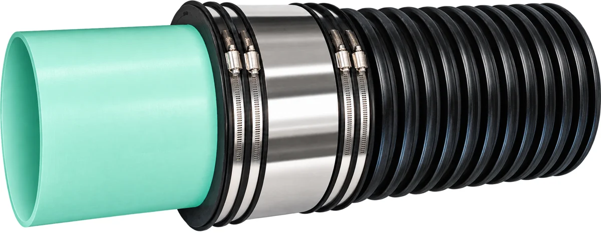 Fernco Strong Back HTRC coupling joining corrugated polyethylene pipe to green PVC pipe
