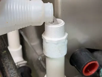 Pouring water into the condensate line above the trap
