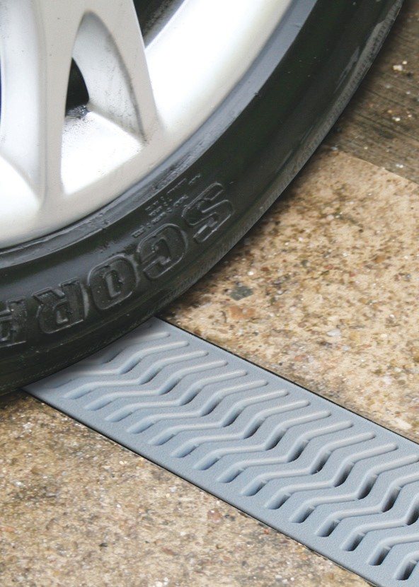 A car tire on a StormDrain Plus grate
